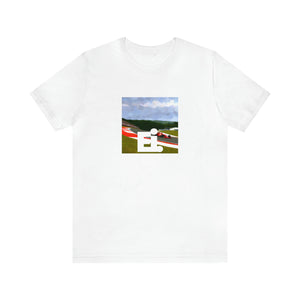 Mario Valentino, a male streetwear designer from Milan, Italy, in the 1990s. He is known for his unique combination of vintage and modern styles, and he is renowned for his attention to detail and quality craftsmanship. He often-Tee