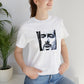 Gina Spazzini, a female streetwear designer from Italy in the 1990s. She specialized in creating bold and edgy designs that combined urban street style with a stylish Italian flair. Her signature look combined bright colors, boxy shapes-Tee