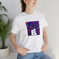 Giavanni DiVenturo, a female streetwear designer from Naples, Italy in the 1990s. She was known for her colorful patterned windbreakers, oversized sweaters, and statement accessories. Her designs were inspired by the-Tee