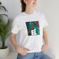 Franzella Marchese, a female streetwear designer from Milan in the '90s. She was known for her edgy and avant-garde designs that made a statement in the fashion world. Her clothes featured bold patterns-Tee