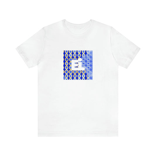 Piero Costa, a male streetwear designer from Italy in the 1990s. His designs included graphic prints, bold colors, and bright fabrics inspired by his hometown of Naples. He was known for collaborating with young artists who helped him create-Tee