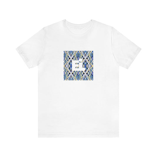 Gabriella Milan, a female streetwear designer from Milan, Italy in the 1990s. She was known for her bold styling, often incorporating animal prints and abstracted patterns into her designs. She was a proponent of the punk aesthetic,-Tee