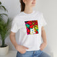 Giovanni Angelo, a flamboyant Italian streetwear designer in the 90s who was known for his wild use of color and bold prints. He favored loud and vivid patterns like stripes, florals, and chevrons-Tee