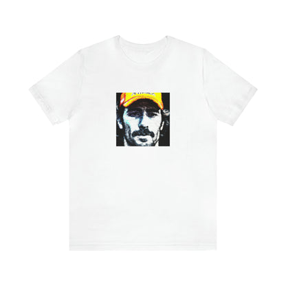 Angelo Matardi. Angelo was a fashion-forward streetwear designer from Italy in the 1990s. He was known for his bold, colorful designs that often featured graphic prints and geometric shapes. He was also known for embracing an edgy,-Tee