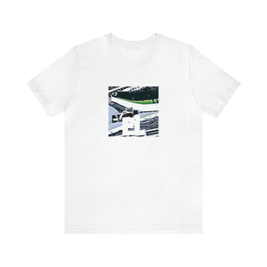 Luisa Rossi is an up-and-coming streetwear designer from Milan, Italy. She started her business in the 1990s and quickly developed a name for herself for her signature bright and vibrant designs inspired by the city's diverse street culture-Tee
