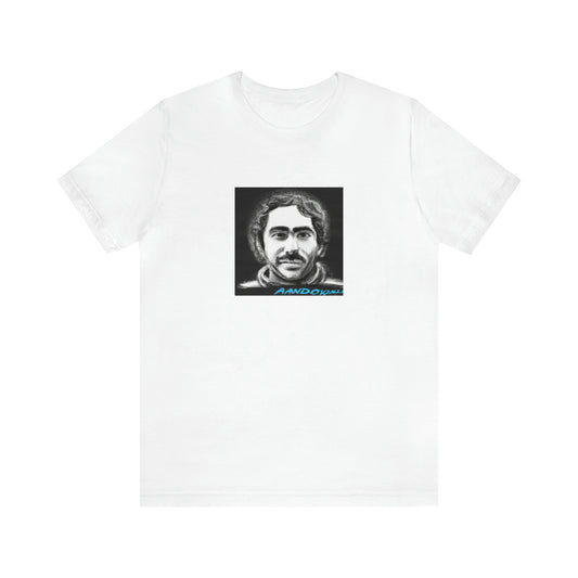 Mauro Torelli. He was an up-and-coming streetwear designer from Milan, Italy in the 1990s. His signature style was incorporating bold lines and geometric shapes into his designs. He was known for his bright color-Tee